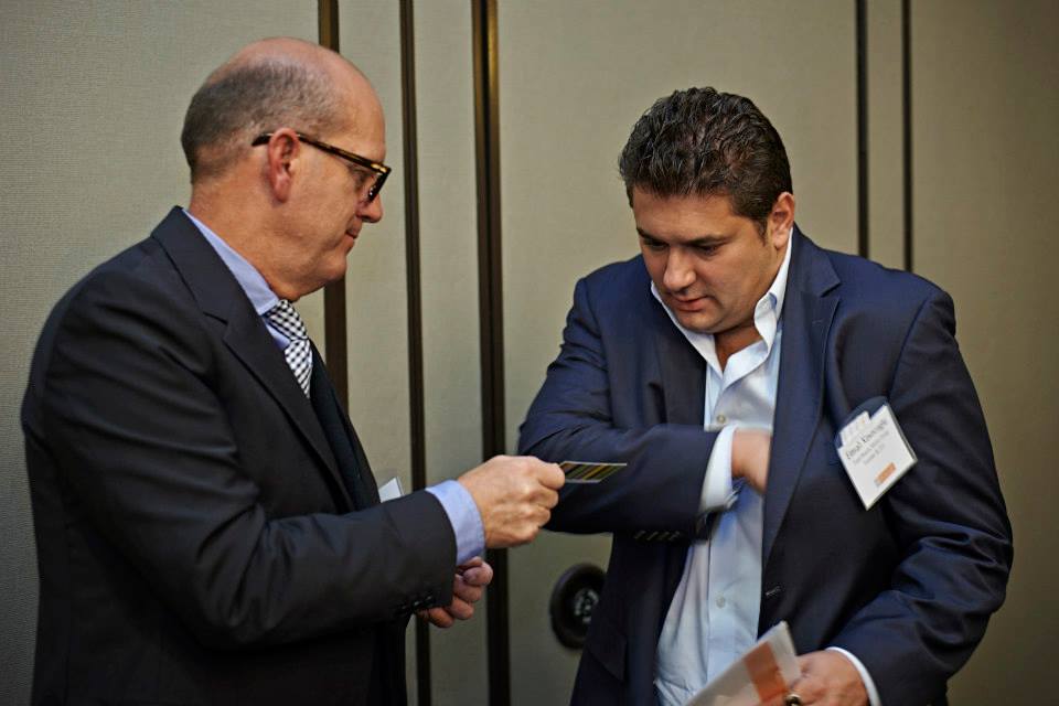 Ron Chavers ( President – Cosmetix West) exchanging business cards with  Emrah Kovacoglu (Founder & CEO - Total Beauty Media Group) at Mazur Group's bi-annual Beauty Biz Roundtable networking event. 